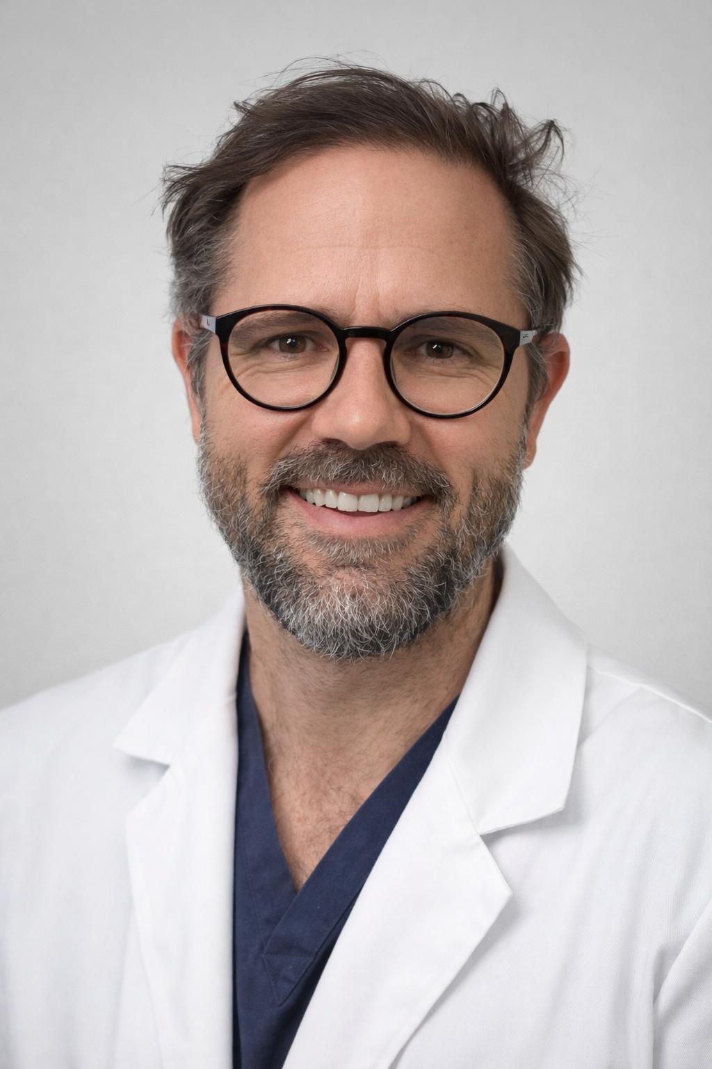 Professor Colin Noel in clinical attire